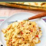 King ranch chicken casserole serving and a fork on a plate.