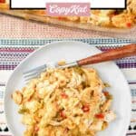 A serving of king ranch chicken casserole and a fork on a plate.