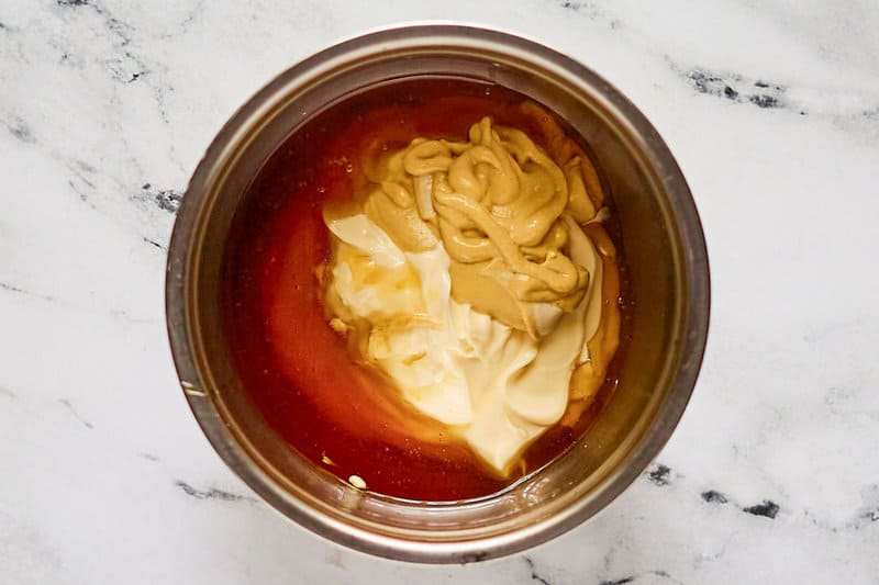 Copycat Outback honey mustard dressing ingredients in a mixing bowl.