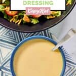 A bowl of homemade Outback honey mustard salad dressing and a salad.
