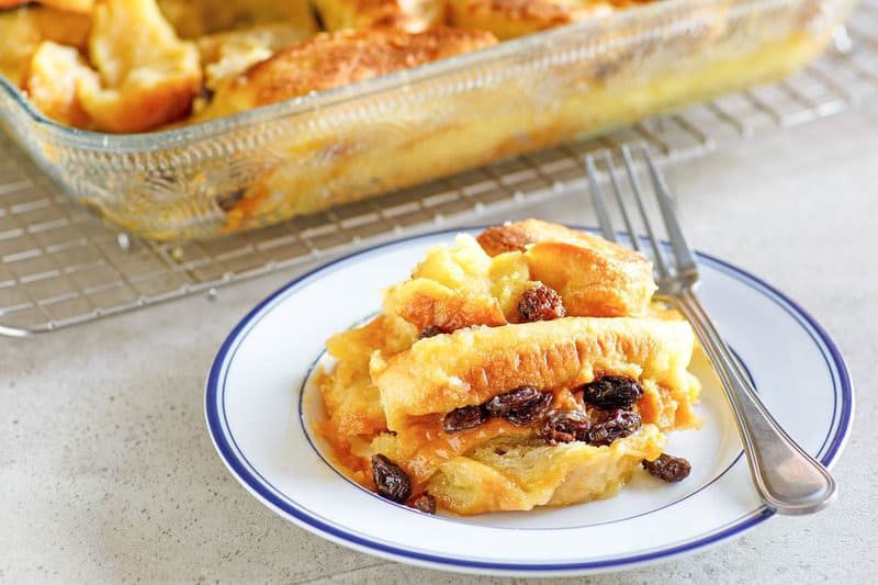 Copycat Raglan Road bread pudding on a plate and in a baking dish.