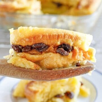 Copycat Raglan Road bread pudding serving on a wooden spoon.