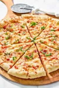 Copycat Red Lobster lobster pizza and a pizza cutter.