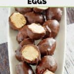 Homemade Reese's chocolate covered peanut butter eggs on a platter.