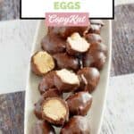 Homemade Reese's chocolate peanut butter eggs on a platter.