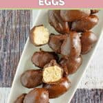 Homemade Reese's peanut butter eggs piled on a platter.