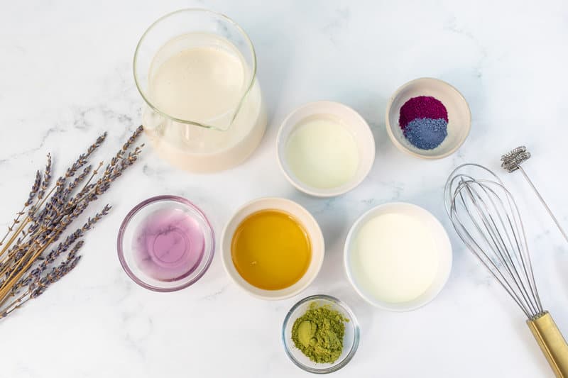 Copycat Starbucks iced lavender cream oatmilk matcha ingredients on a marble surface.