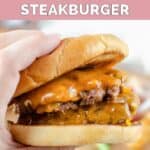 Hand holding a copycat Steak and Shake garlic double steakburger.