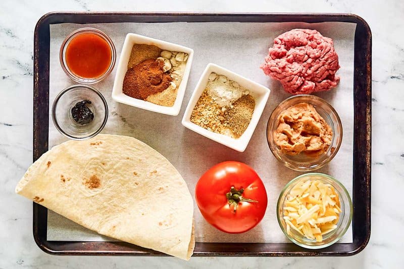 Copycat Taco Bell Mexican pizza ingredients on a tray.