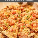 Homemade Taco Bell Mexican pizza on a wood board.