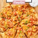 Homemade Taco Bell Mexican pizza and a cup of sour cream.
