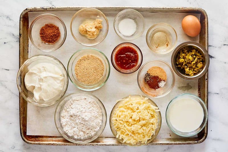 Copycat Texas Roadhouse rattlesnake bites and cajun sauce ingredients on a tray.