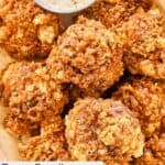 Homemade Texas Roadhouse rattlesnake bites and a cup of dipping sauce.