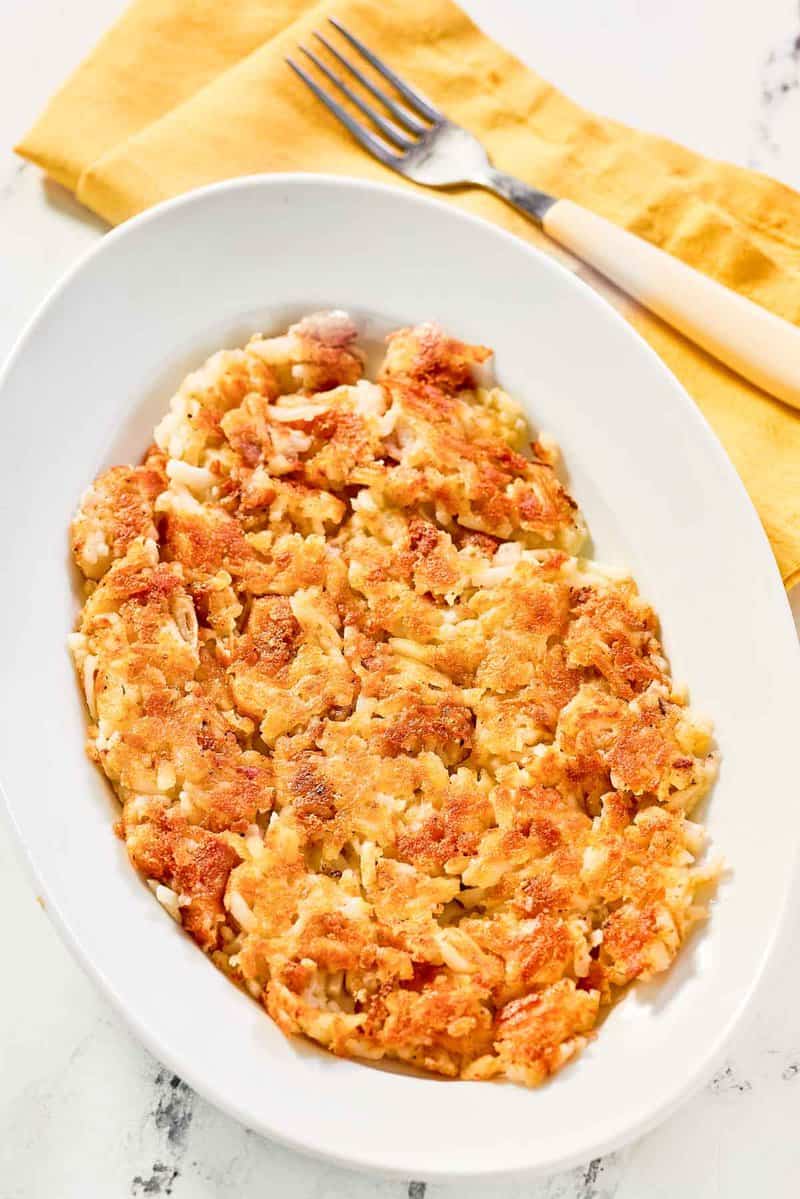 Copycat Waffle House hash browns and a fork on a napkin.