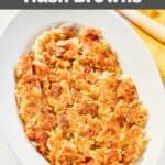 Homemade Waffle House hash browns on a plate on a marble surface.