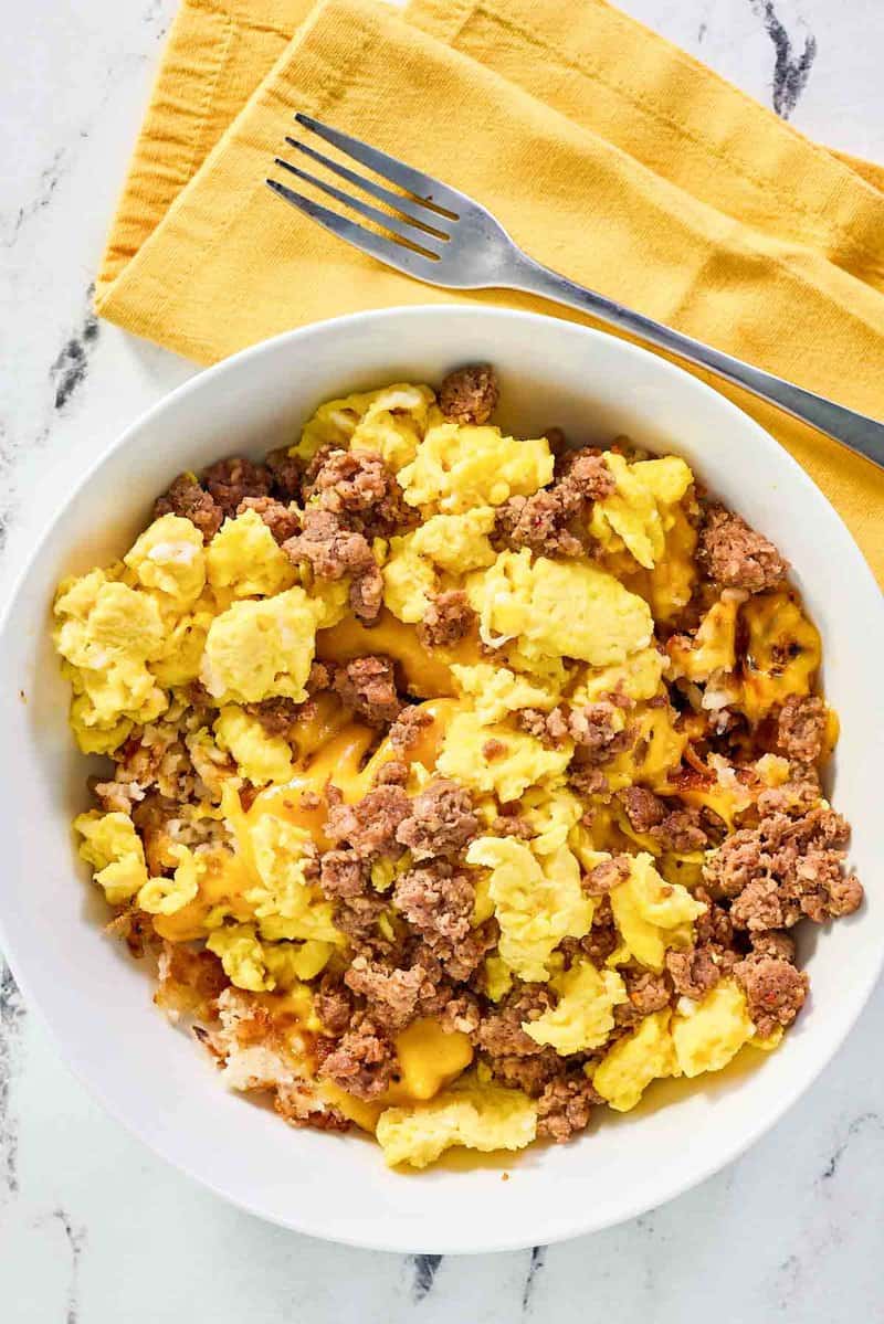 Copycat Waffle House hash brown bowl with sausage, egg, and cheese.