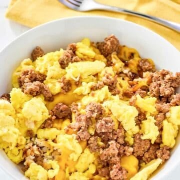 Copycat Waffle House sausage, egg, and cheese hashbrown bowl.