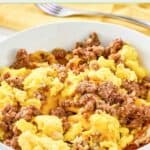 Homemade Waffle House hash brown bowl with sausage, eggs, and American cheese.