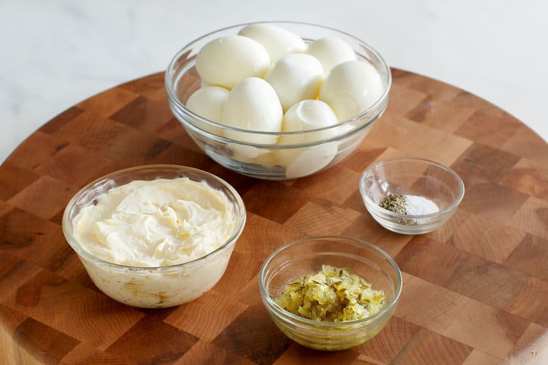 Copycat chicken salad chick egg salad ingredients in bowls.