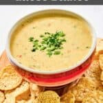 Homemade Chipotle queso blanco and tortilla chips on a platter.