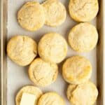 Homemade freezer biscuits on a baking sheet.