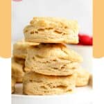 Three homemade freezer biscuits stacked on a plate.