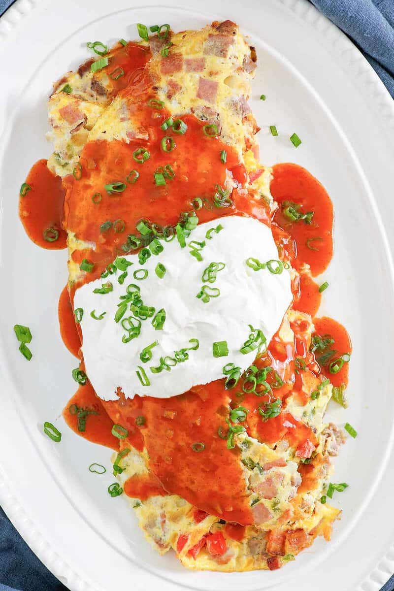 Copycat IHOP Colorado omelette on large oval plate.