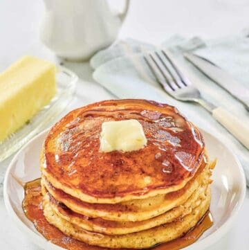 Copycat IHOP protein pancakes topped with butter and syrup.