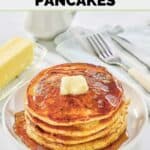 Homemade IHOP protein pancakes on a plate and a knife and fork beside it.