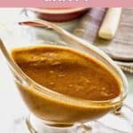 Homemade KFC gravy in a glass gravy boat.