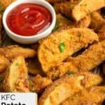 Homemade KFC potato wedges and a small cup of ketchup.