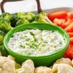 Homemade Melting Pot green goddess dip and vegetables on a tray.