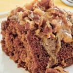 A slice of oatmeal cake with coconut pecan frosting.