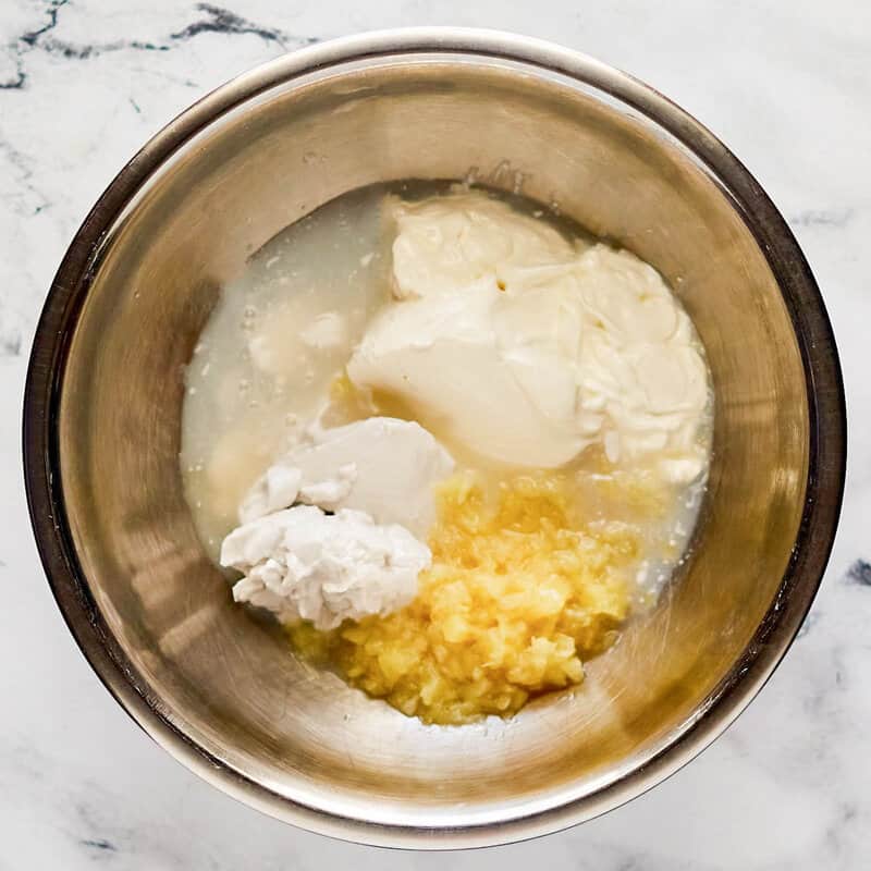 Copycat Red Lobster pina colada coconut shrimp sauce ingredients in a mixing bowl.