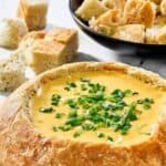 Homemade Red Lobster ultimate seafood fondue dip and a bowl of bread cubes.