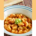 A bowl of homemade ruth's chris barbecue shrimp.