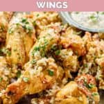 Homemade Buffalo Wild Wings garlic parmesan wings piled on a plate.