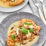 Copycat Carrabba's chicken bryan on two plates.