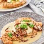 Homemade Carrabba's chicken bryan on a plate and forks behind it.