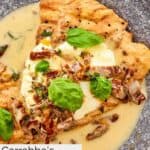 Homemade Carrabba's chicken bryan garnished with fresh basil leaves.