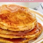 Homemade McDonald's pancakes topped with syrup on a plate.