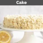 A whole homemade Olive Garden lemon cream cake on a cake stand.
