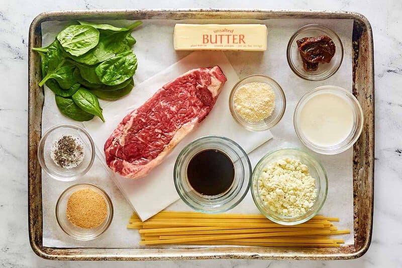 Copycat Olive Garden steak gorgonzola alfredo ingredients on a tray.
