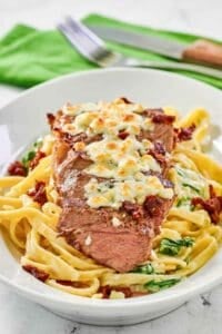 Copycat Olive Garden steak gorgonzola alfredo on a platter.