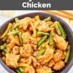 Homemade Panda Express honey sesame chicken in a bowl on a marble surface.