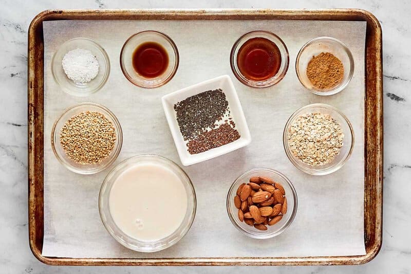 Homemade brekki overnight oats ingredients on a tray.