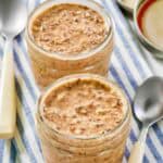 Homemade brekki overnight oats in jars and two spoons.