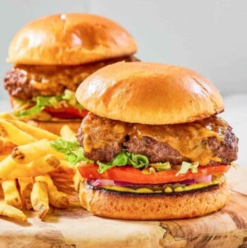 Two copycat Chili's oldtimer burgers with cheese and French fries.