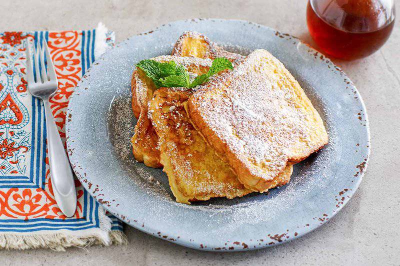 Copycat Denny's French toast on a plate and a fork next to it.