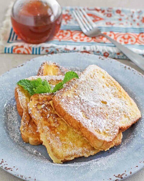 Copycat Denny's French toast, syrup, and a fork.